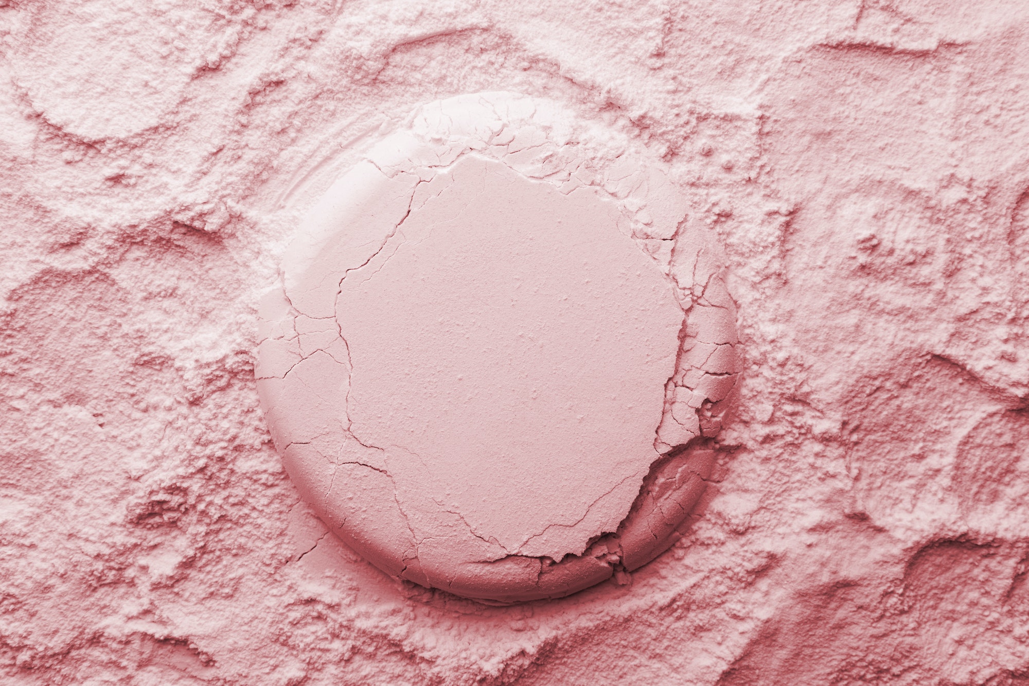 Cosmetic background, clay texture. Mask pink dry clay for face and body
